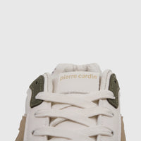 Close-up of a beige and olive Pierre Cardin ladies' casual sneaker showing laces and the brand logo on the tongue.