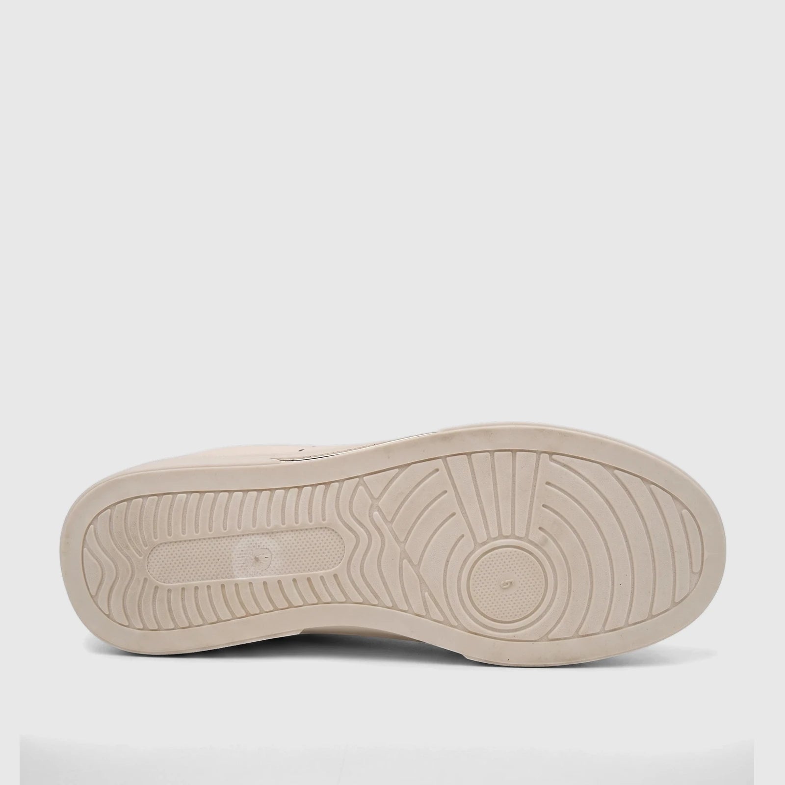Bottom view of a beige PC Ladies Casual Sneaker, showcasing the detailed patterned outsole. Designed for comfort and style.