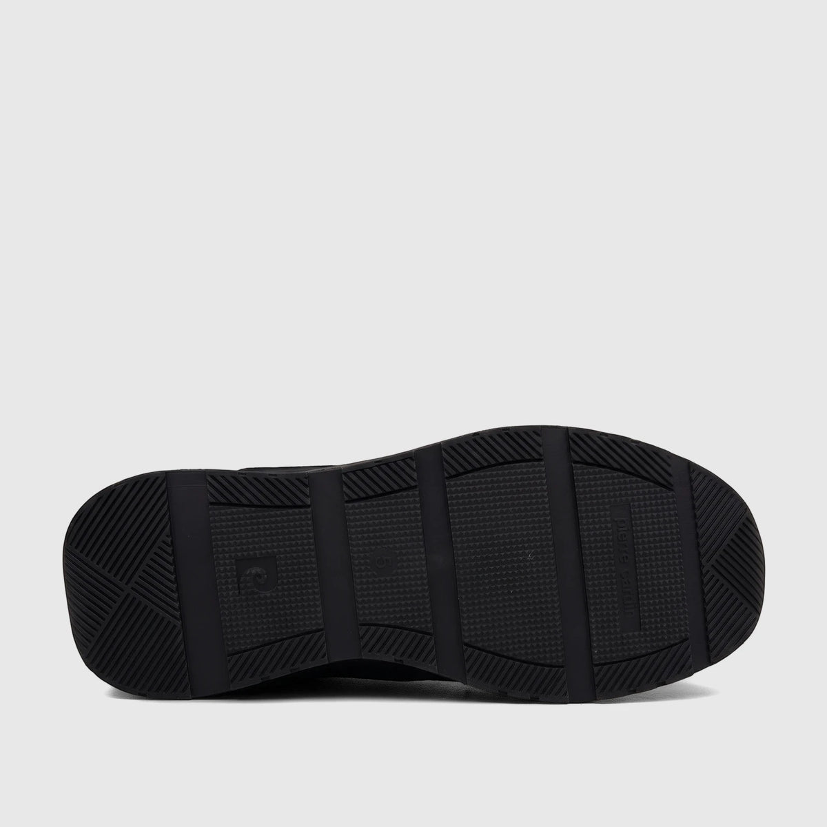 Sole of a black PC Ladies Casual Sneaker showing the textured tread pattern and branding, against a white background.