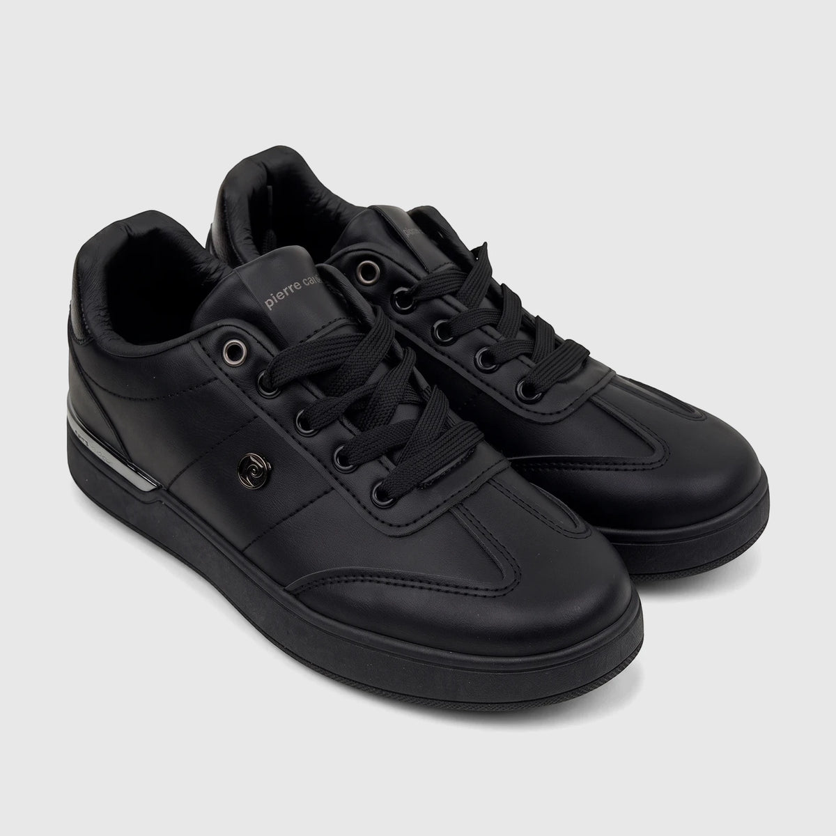 A pair of black PC Ladies Casual Sneakers PCL11006 by Pierre Cardin, made of a smooth leather-look material with black
