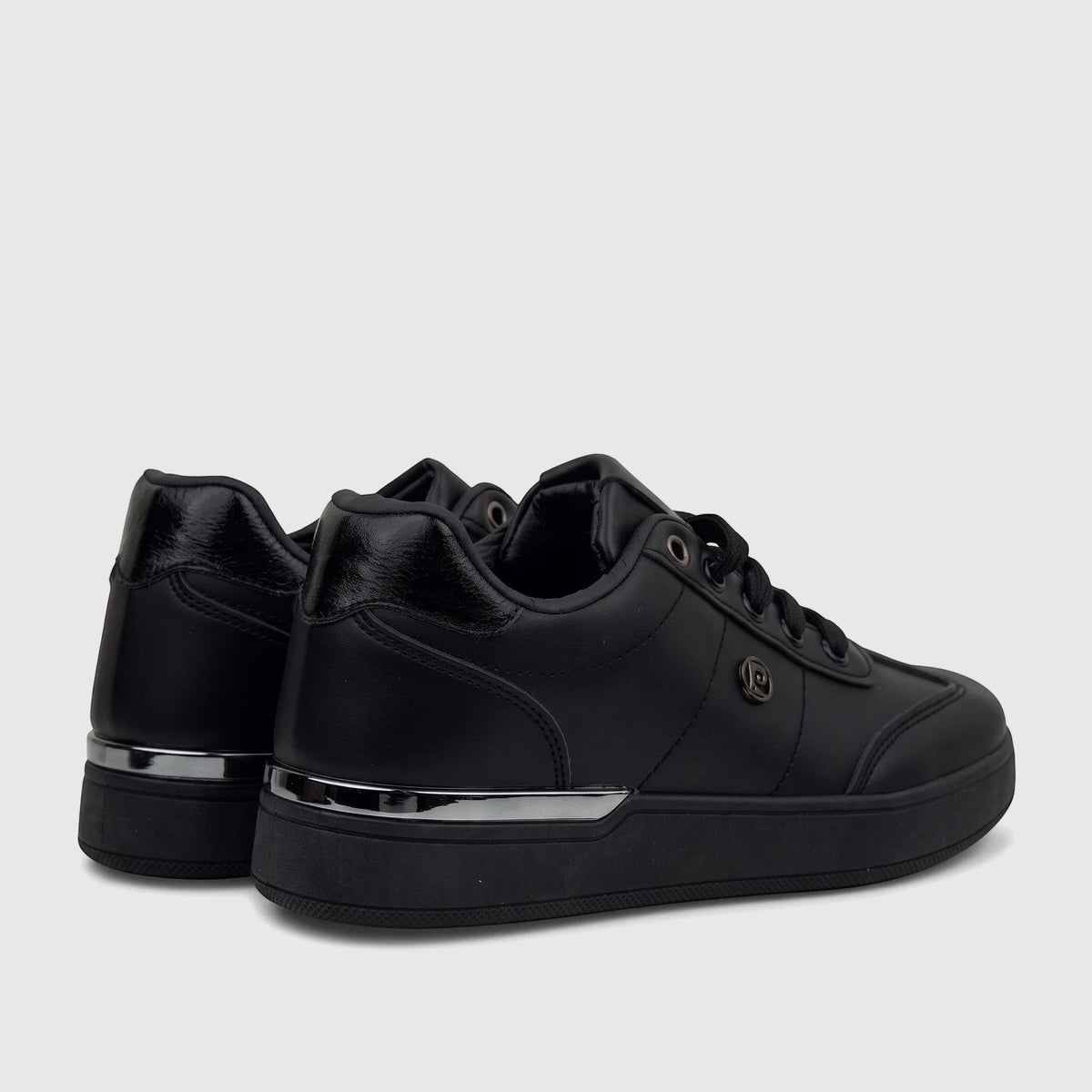 Pair of black PC Ladies Casual Sneakers PCL11006 with metal trim on the sole, shown from a rear-right perspective.