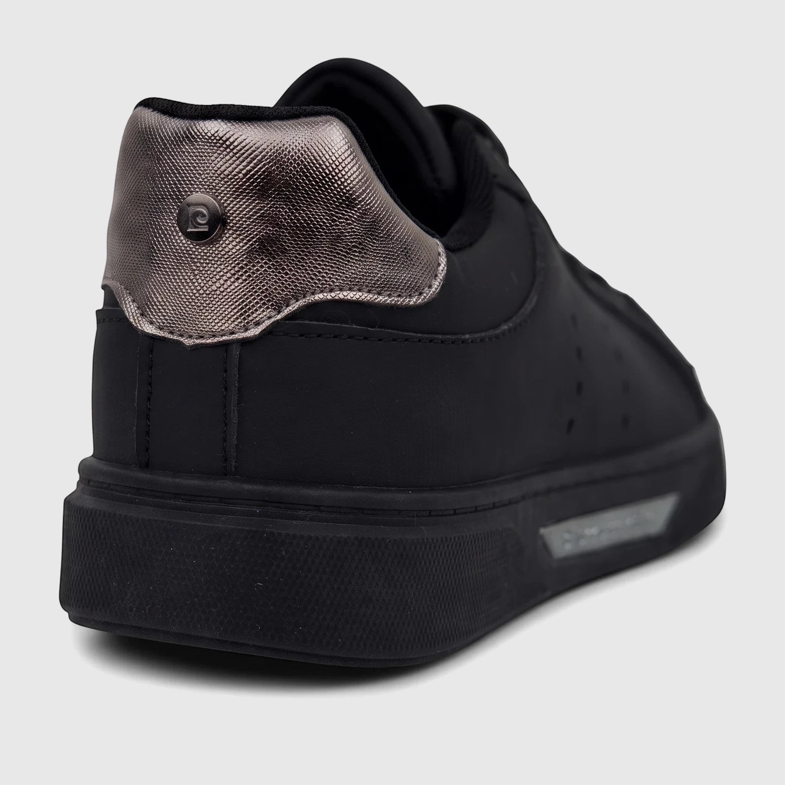 Close-up rear view of a PC Ladies Casual Sneaker in black, featuring a textured metallic silver heel panel and black sole.