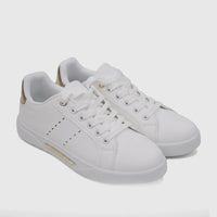 A pair of PC Ladies Casual Sneakers in white with gold accents, featuring white laces and a low-top design, displayed on a