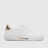 White Pierre Cardin ladies' casual sneakers with gold heel accents, visible laces, and the brand logo on the side.