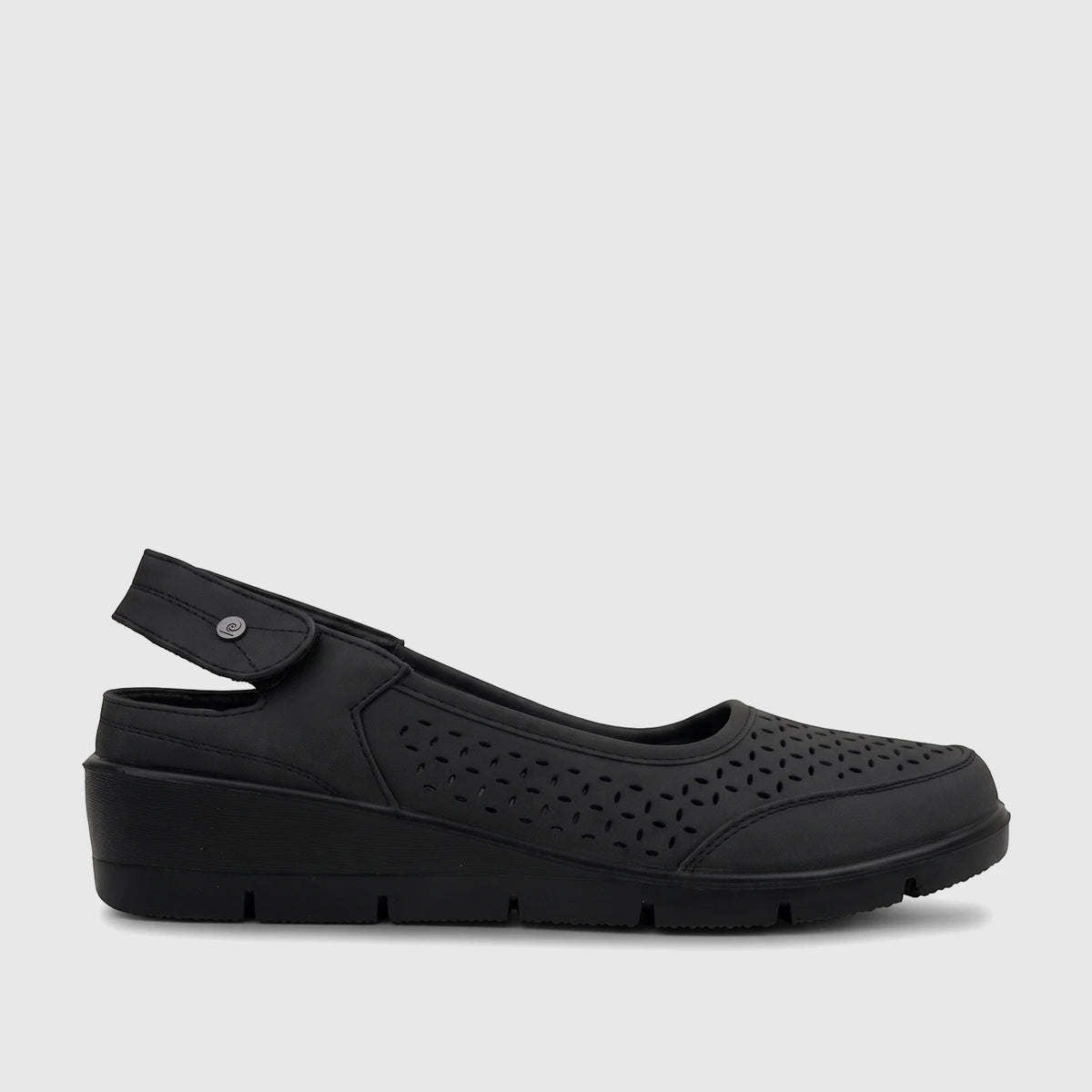 Single black PC Ladies Casual Wedge shoe, PCL10994, with perforated details and a slingback strap, viewed from the side.