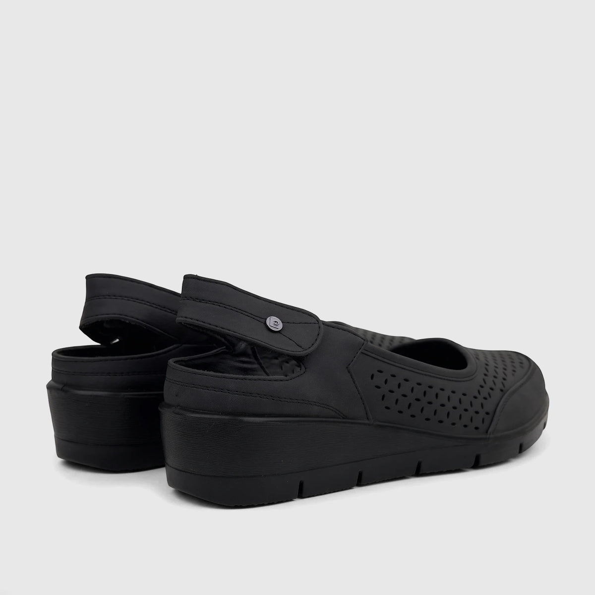 Black PC Ladies Casual Wedge sandals featuring perforated uppers, an adjustable ankle strap, and a comfortable wedge heel.