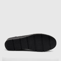 Black PC Ladies Casual Wedge shoe, sole view, featuring a textured platform and a size marking visible on the bottom.