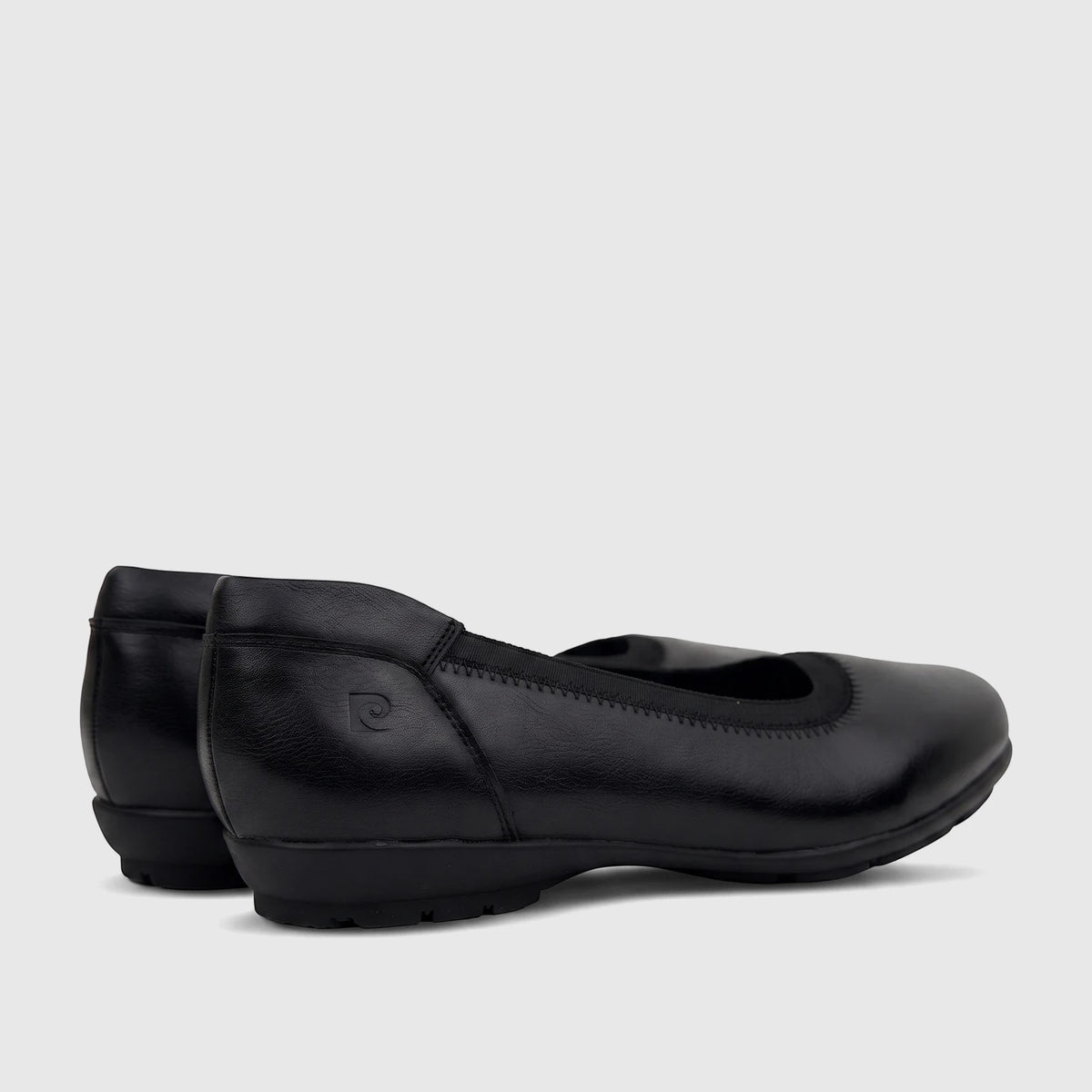 Pair of PC Ladies Comfort Pump ballet flats in black, featuring a smooth finish, elasticated topline, and a low block heel.