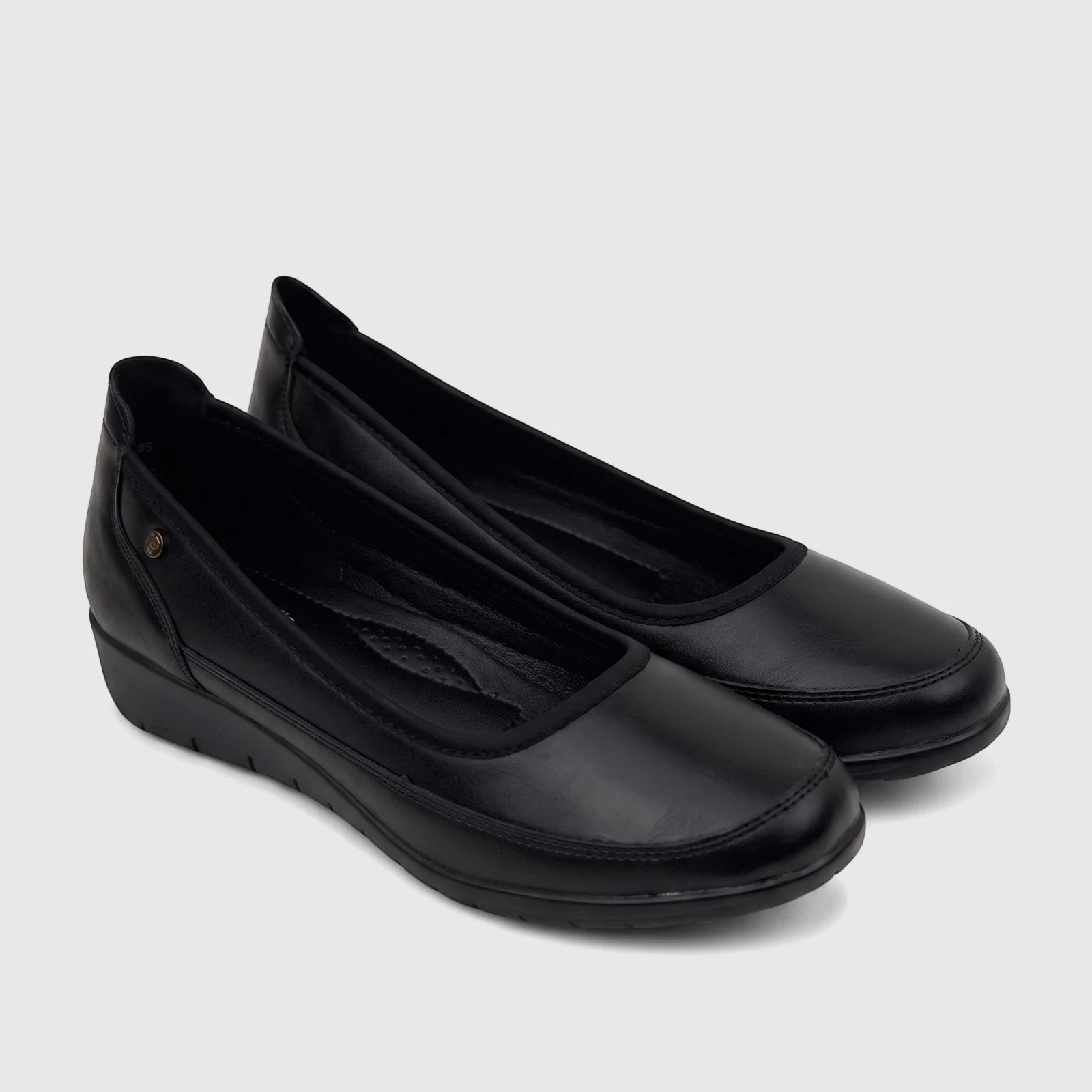 Pair of black PC Ladies Comfort Pump PCL10965 shoes, crafted from a leather-like material for everyday comfort.