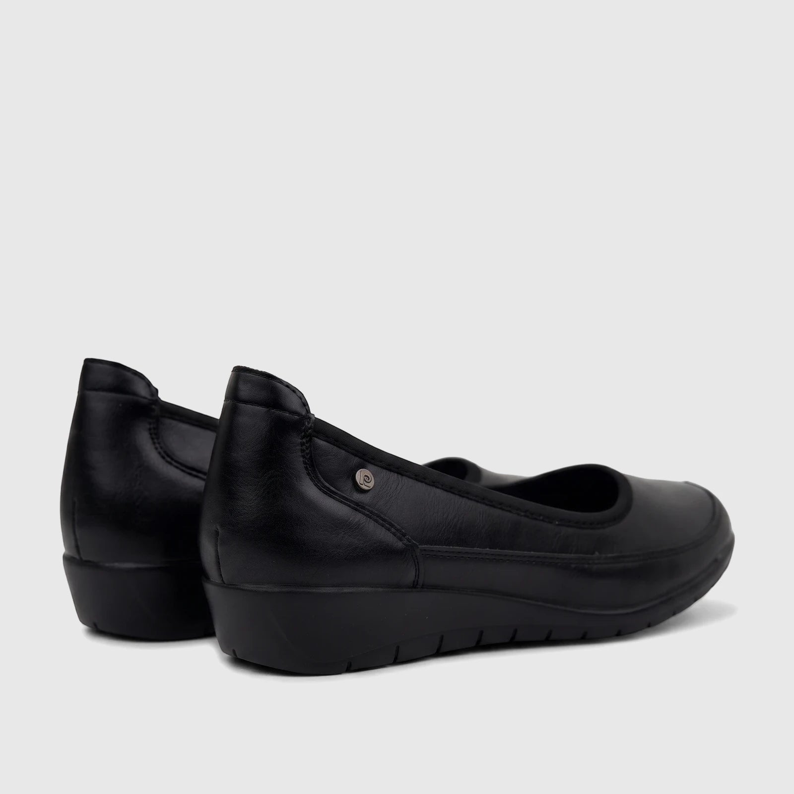 Black PC Ladies Comfort Pump PCL10965 shoes, featuring a smooth finish and a low wedge heel, for women's comfort.