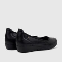 Black PC Ladies Comfort Pump PCL10965 shoes, featuring a smooth finish and a low wedge heel, for women's comfort.