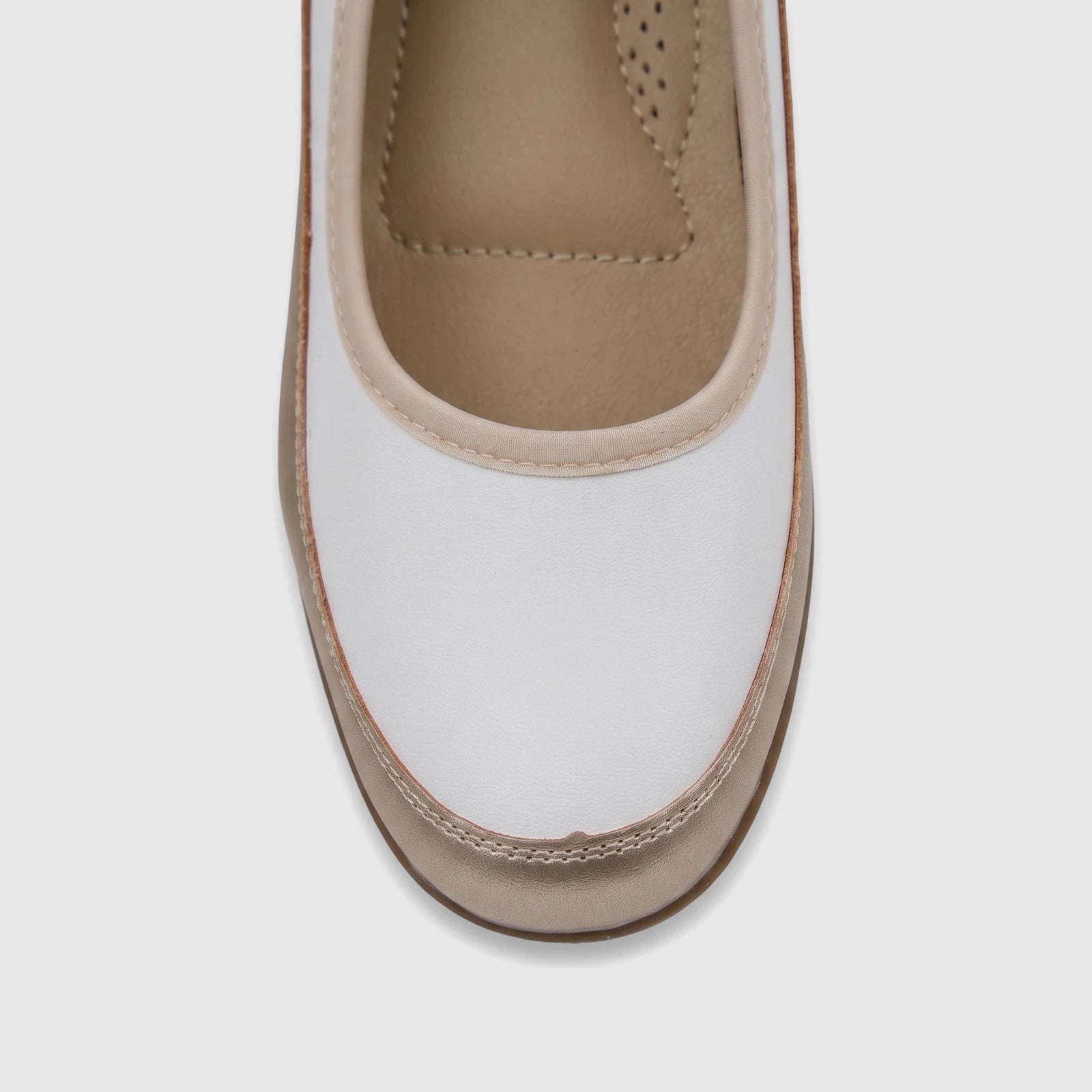 Close-up of a white and gold PC Ladies Comfort Pump PCL10965, highlighting its comfortable design and precise stitching.