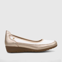 White and gold ladies' comfort pump PCL10965 from a side view, featuring a subtle wedge heel and textured brown sole.
