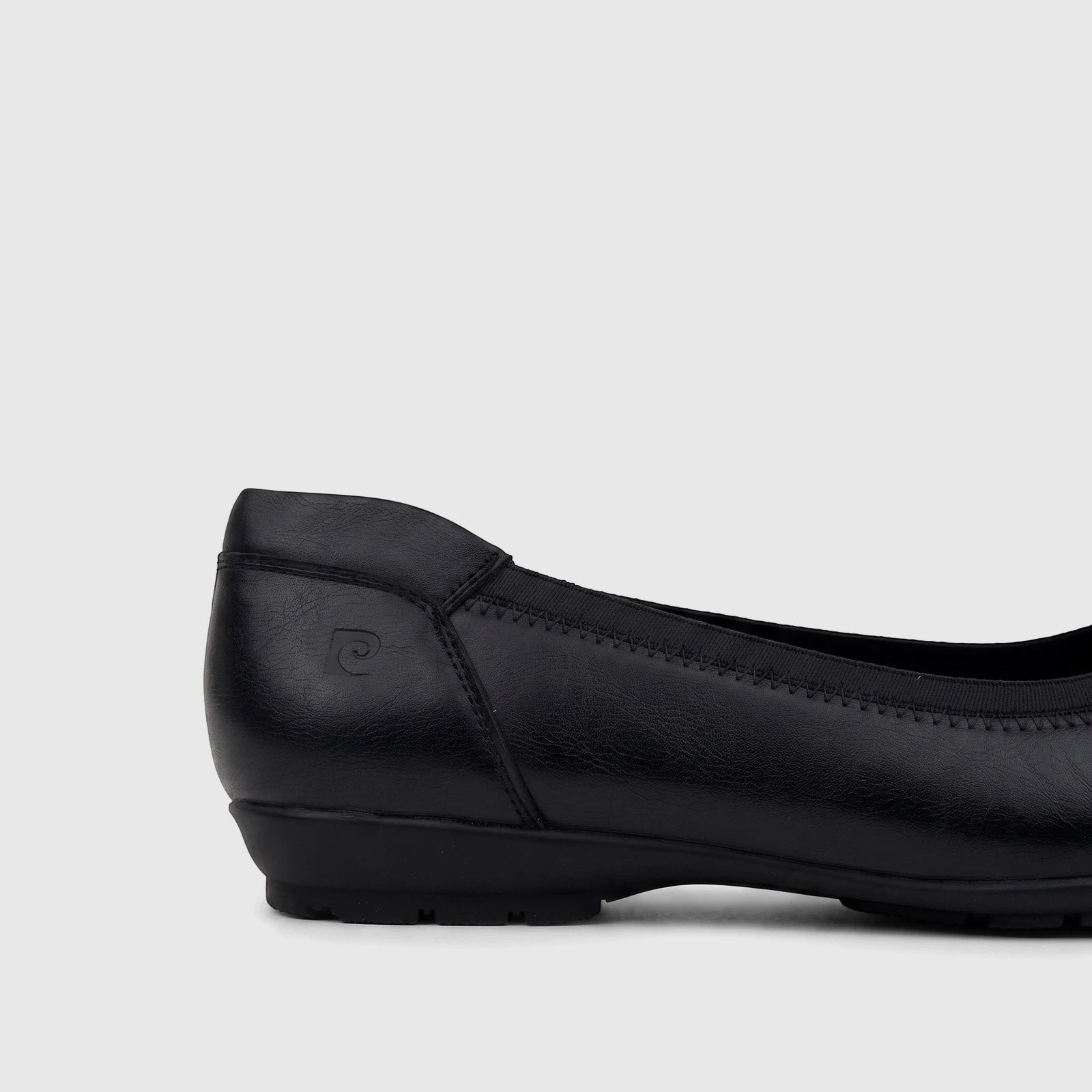 Black PC Ladies Comfort Pump PCL10966 with a low heel, visible from a side angle, showcasing its faux leather texture and