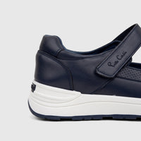 Navy blue women's PC Ladies Comfort Pump shoe with white platform sole, featuring a Pierre Cardin velcro strap, shown from a