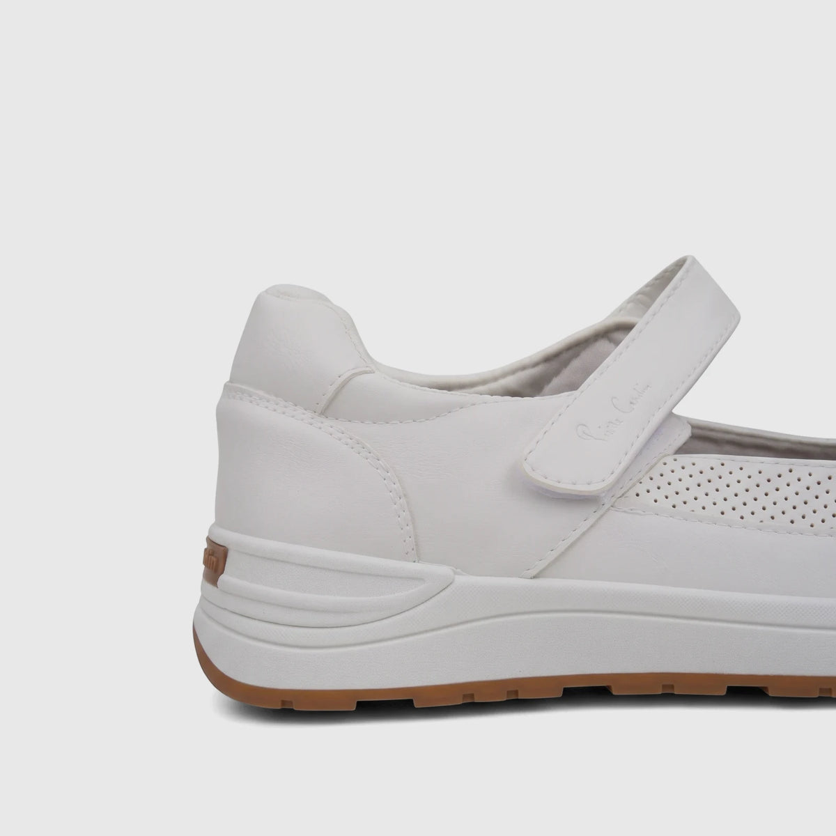 Close-up of a white PC Ladies Comfort Pump PCL10986 PC425 shoe, featuring a velcro strap, perforated side detail, and a