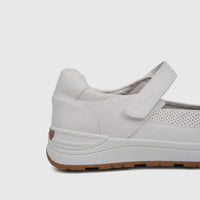 Close-up of a white PC Ladies Comfort Pump PCL10986 PC425 shoe, featuring a velcro strap, perforated side detail, and a