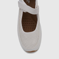 A close-up, top-down view of a white PC Ladies Comfort Pump shoe with perforated detailing and a hook-and-loop strap.