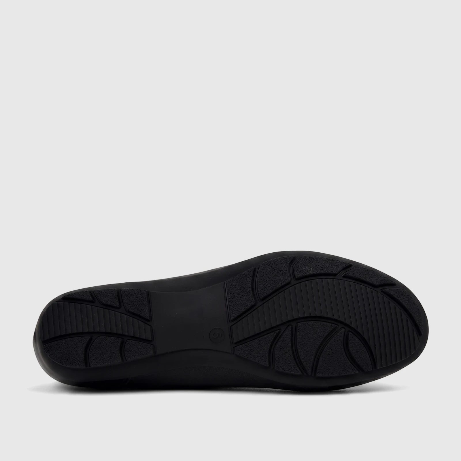 Bottom view of a black PC Ladies Comfort Pump shoe, showcasing its textured sole with a durable tread pattern.