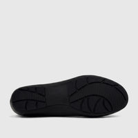 Bottom view of a black PC Ladies Comfort Pump shoe, showcasing its textured sole with a durable tread pattern.