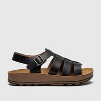 Black PC Ladies Comfort Sandal PCL11020 with a thick brown sole, black strappy upper, and an adjustable silver buckle, shown