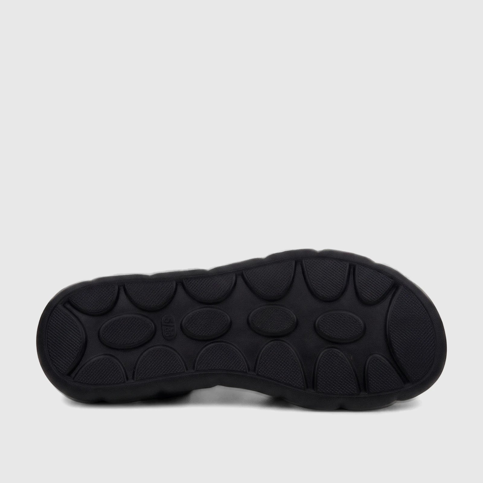 Black PC Ladies Comfort Sandal PCL10974 with a textured sole, viewed from the underside, highlighting the pattern and size