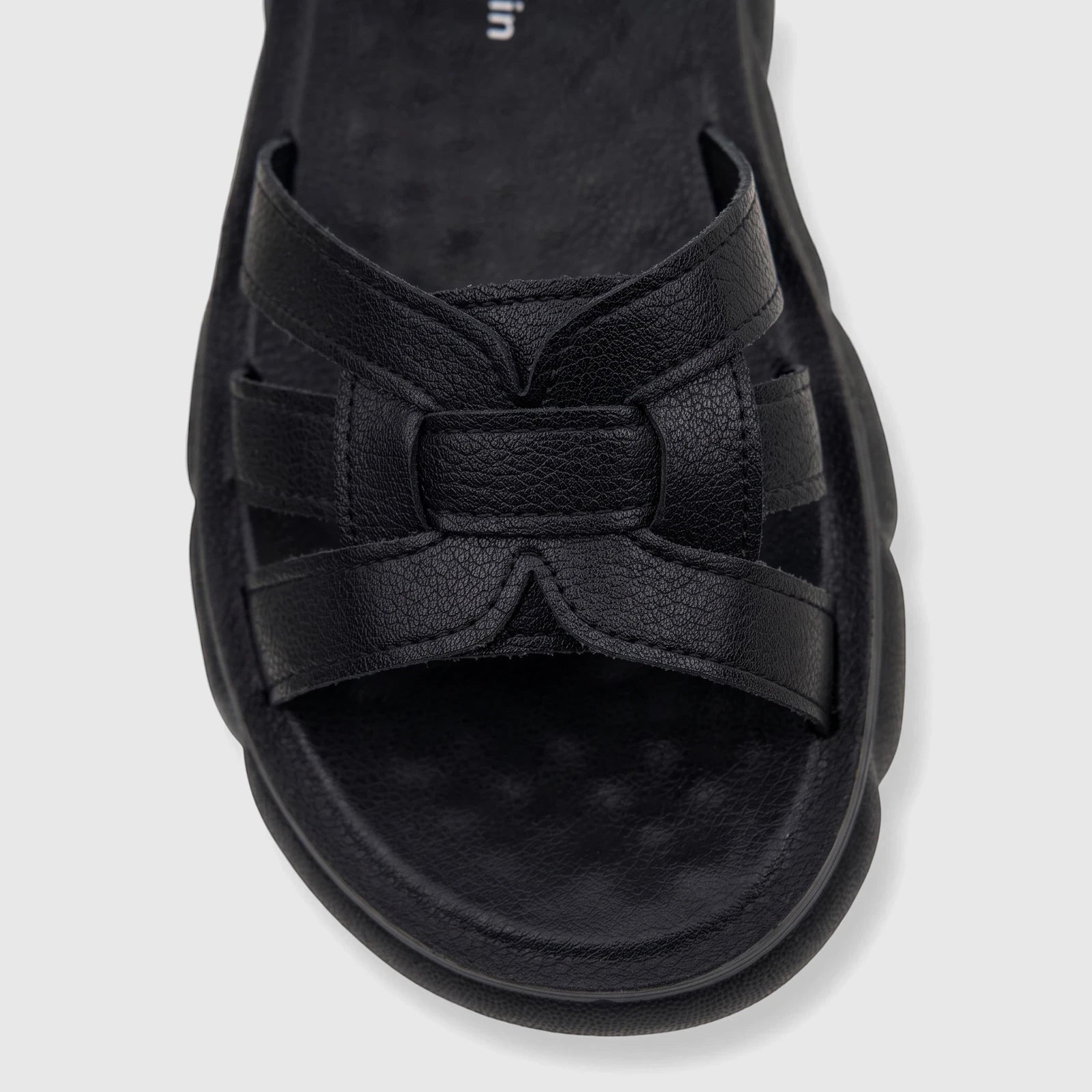 Close-up of a black PC Ladies Comfort Sandal with textured straps and a thick, sculpted sole, viewed from above.