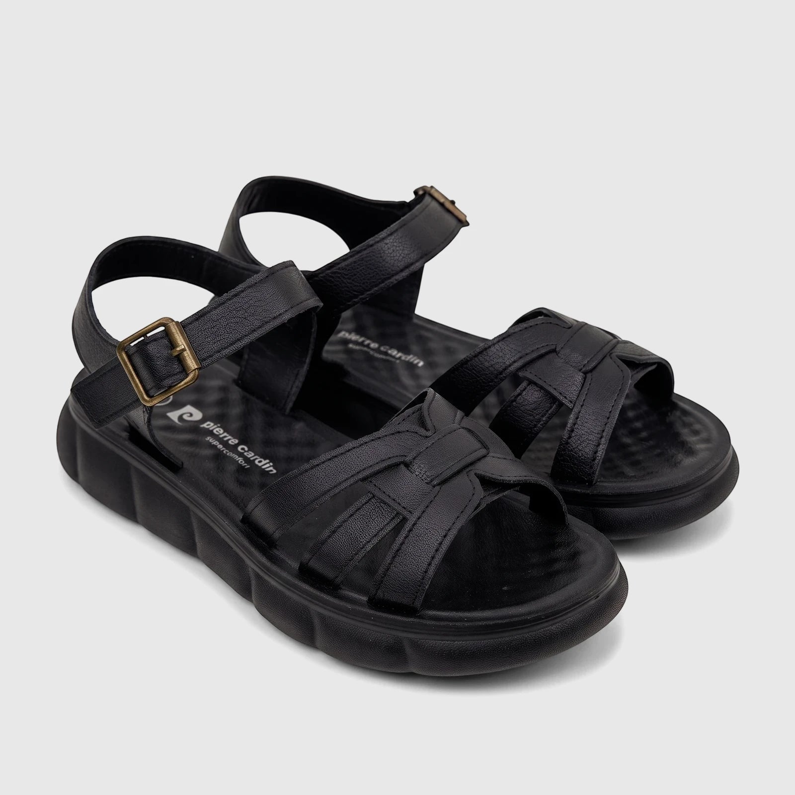 Black Pierre Cardin Supercomfort ladies' sandals with textured straps and a platform sole, shown from an elevated front view.