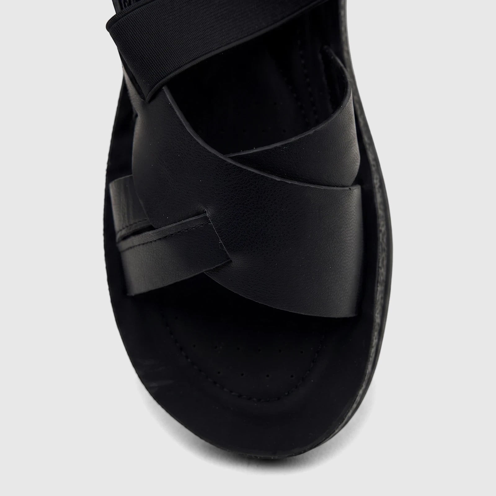 Black PC Ladies Comfort Sandal PCL10975 with criss-cross straps, showcasing the textured material and comfortable sole.