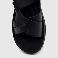 Black PC Ladies Comfort Sandal PCL10975 with criss-cross straps, showcasing the textured material and comfortable sole.