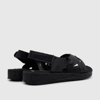 Black PC Ladies Comfort Sandals PCL10975 with adjustable straps and textured sole, shown from a side-rear view.