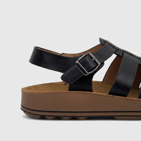 Black PC Ladies Comfort Sandal, PCL11020, featuring black leather straps, a silver buckle, and a brown platform sole, shown