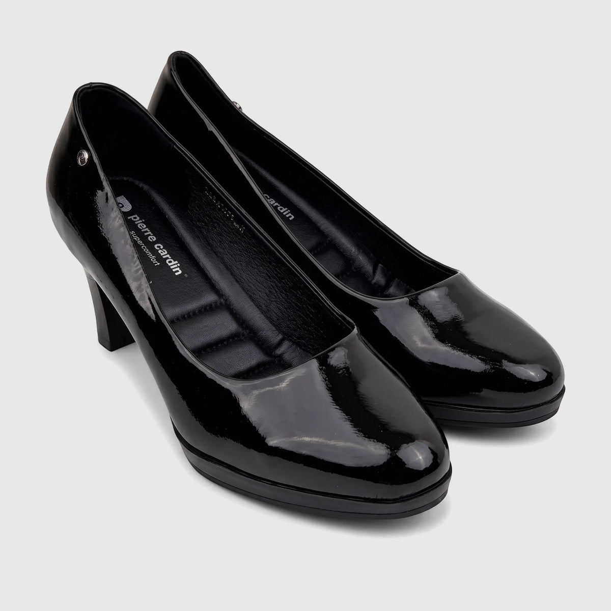 Pair of black patent leather women's high heel court shoes by Pierre Cardin, featuring a glossy finish.