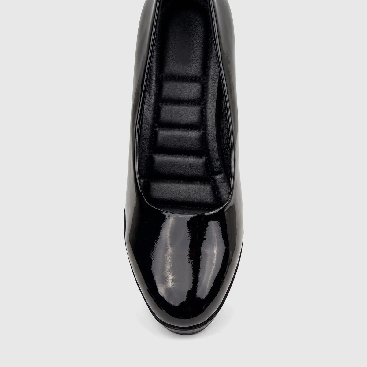 Top-down view of a PC Ladies Dress Court PCL10708 shoe in black patent leather, showcasing its glossy finish and quilted