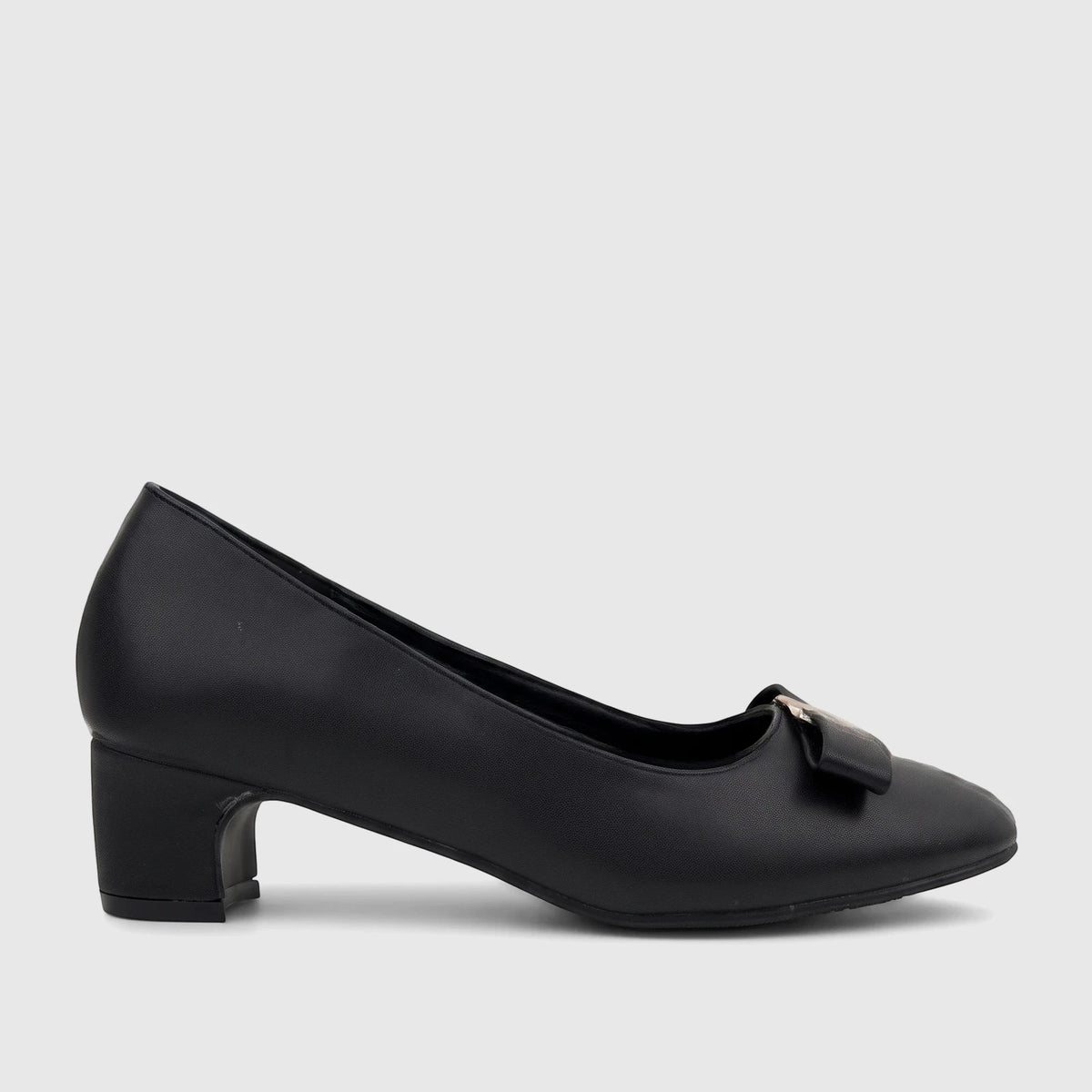 Black PC Ladies Dress Court shoe PCL11037, featuring a block heel and a stylish gold-accented bow, viewed in profile.