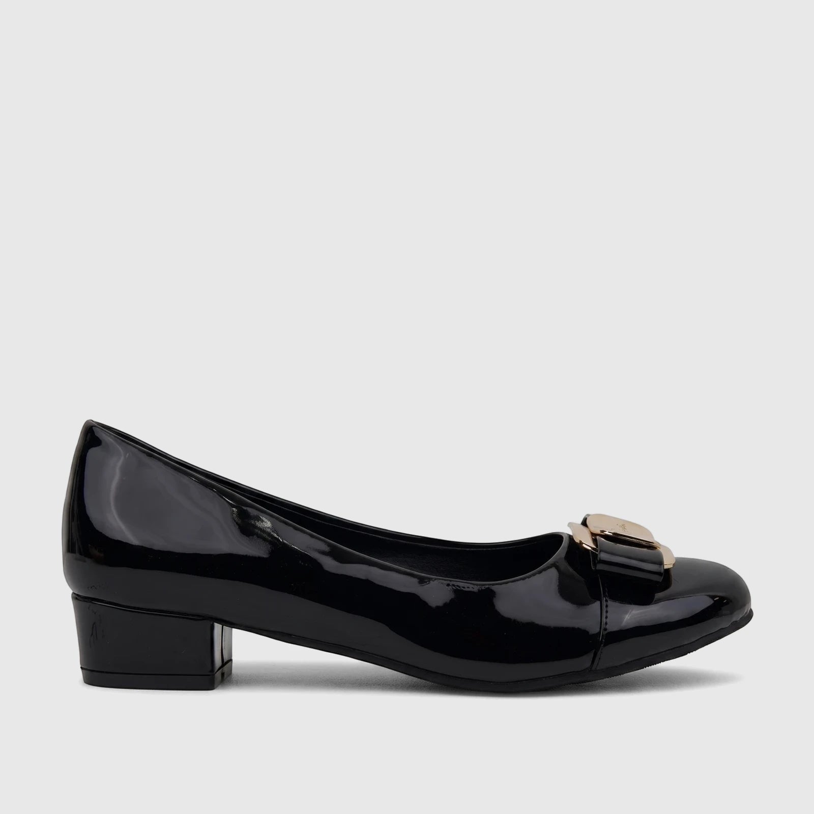 Black patent leather ladies dress court shoe with a low block heel and decorative gold-tone buckle, viewed from the side.