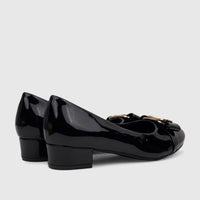Pair of PC Ladies Dress Court Shoes in black patent leather, featuring a low block heel and gold buckle detail, viewed from
