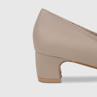 Close-up side view of a nude beige PC Ladies Dress Court shoe with a sturdy block heel, ideal for formal wear.