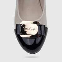 PC Ladies Dress Court Shoe PCL11026 featuring a glossy black toe and nude upper with a gold 'Pierre Cardin' buckle, close-up