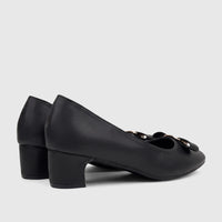 Black ladies dress court shoes with a block heel and gold buckle detailing, viewed from a side angle.