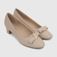 Pair of elegant nude faux leather PC Ladies Dress Court shoes with bow details and distinctive gold-tone buckles, in a