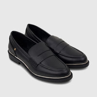 A pair of black PC Ladies Dress Loafers, made of leather with a silver trim, viewed from a high angle.