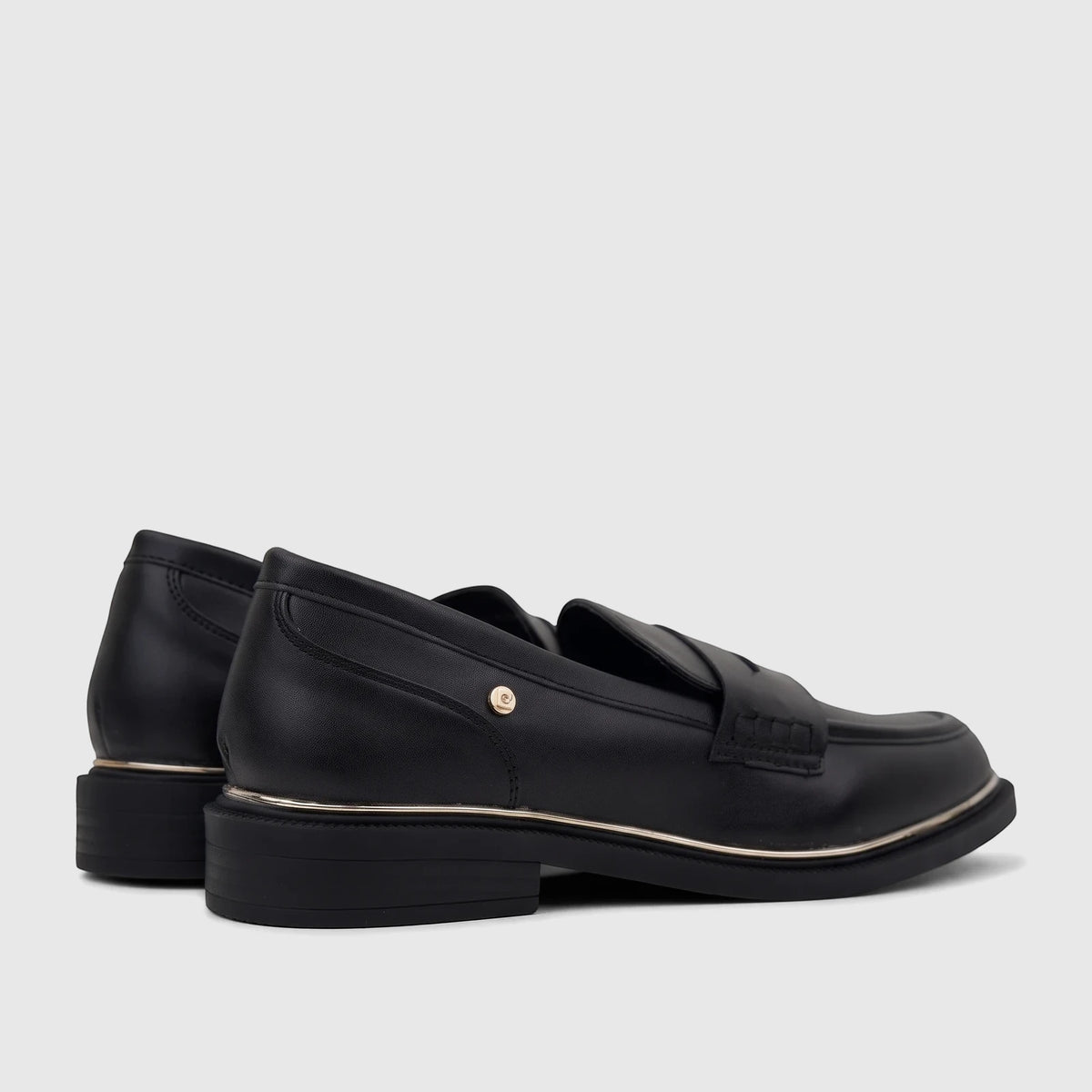 Pair of black PC Ladies Dress Loafers PCL10996, made of leather with a gold-tone trim, captured from a side angle.