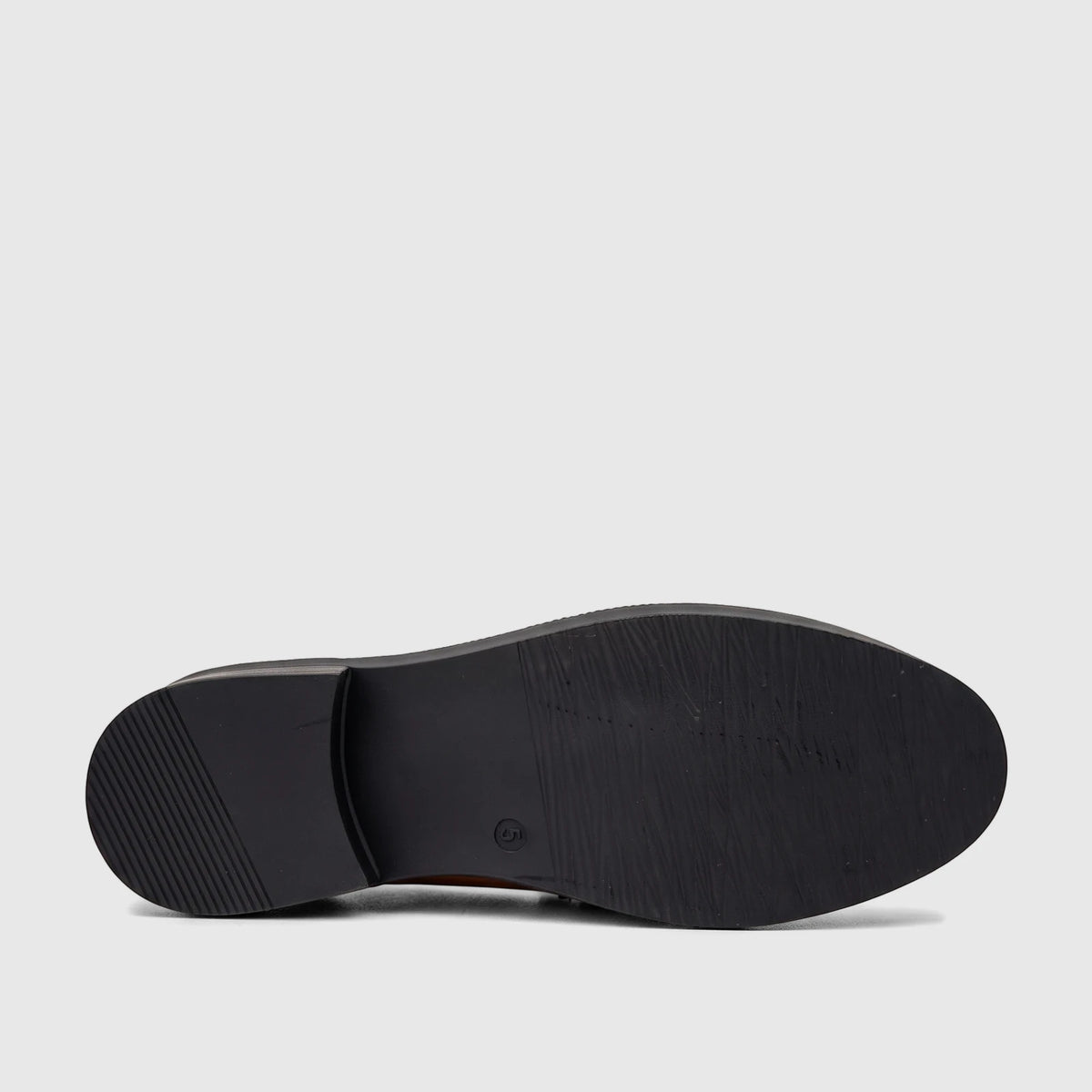 Underside view of a black PC Ladies Dress Loafer shoe, featuring a textured sole and a small heel.