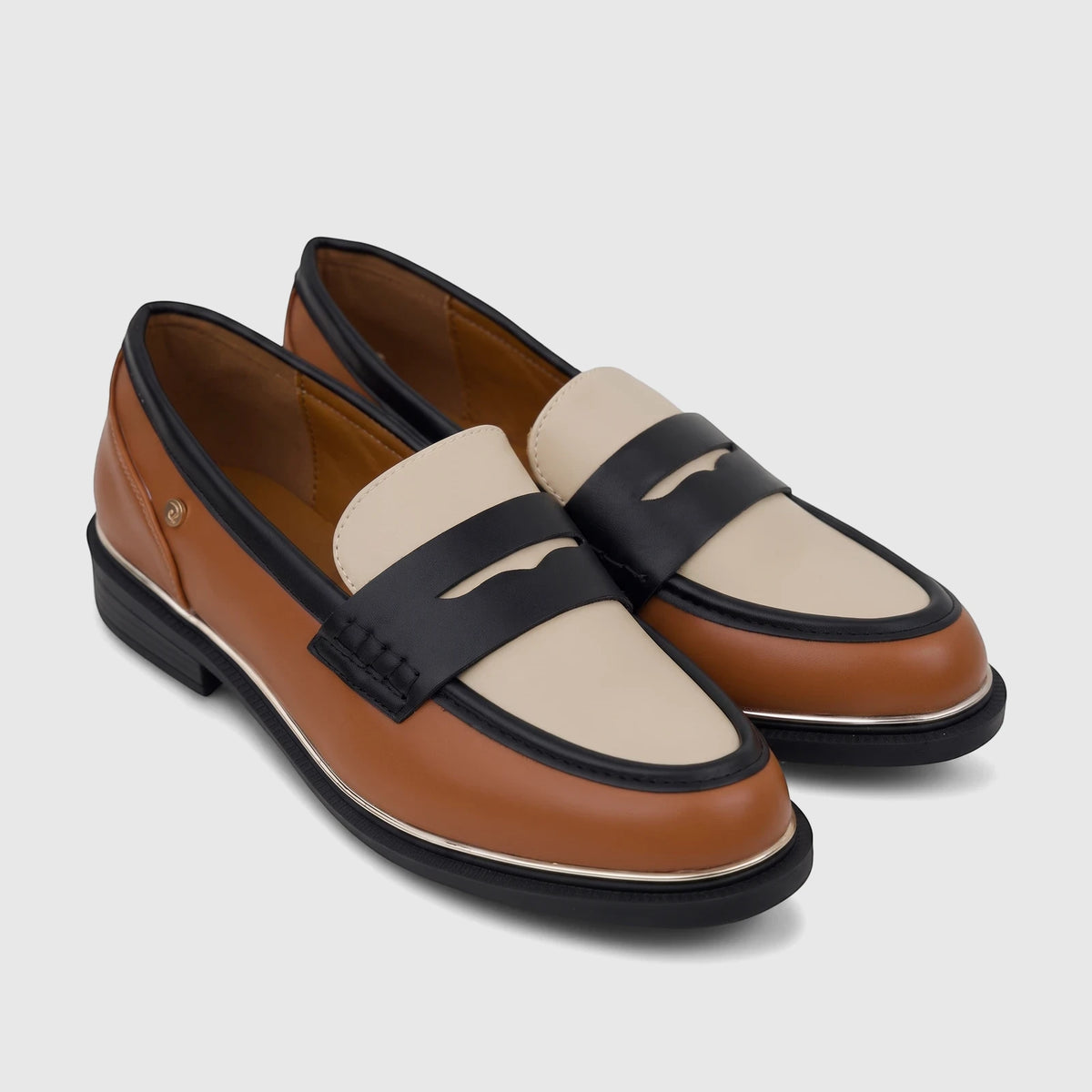 Pair of PC Ladies Dress Loafers in tan and cream with black straps and gold trim, seen from a slightly elevated angle.