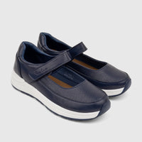 Pair of women's dark blue Pierre Cardin Mary Jane comfort shoes with perforated details and white wedge soles, side view.