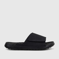 Men's black comfort slide sandal with a textured sole and adjustable strap, shown in a side profile view.