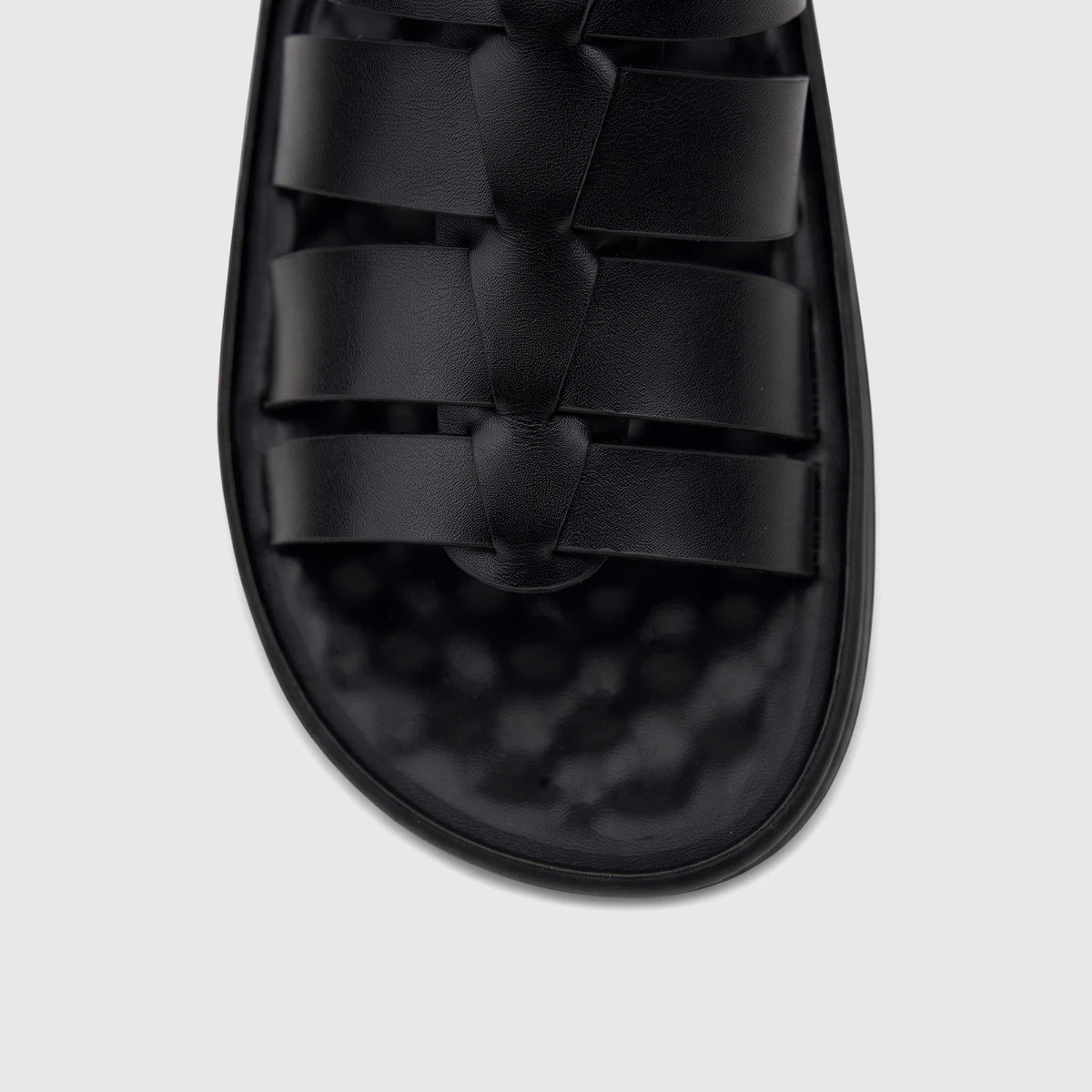 Close-up view of a PC Men's Casual Comfort Sandal in black, featuring multiple braided straps across the top.