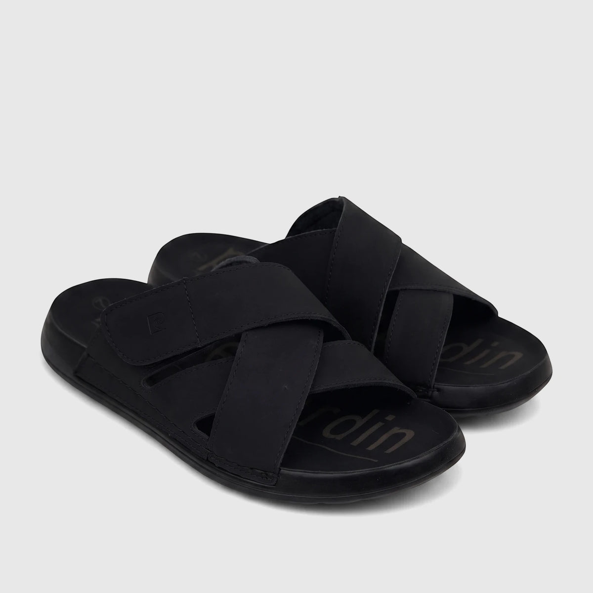 A pair of black PC Men's Casual/Comfort Sandals with criss-cross straps and an adjustable closure, shown on a white surface.