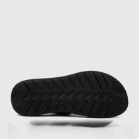 Bottom view of a black PC Men's Casual/Comfort Sandal, showcasing the patterned rubber sole for grip and durability.